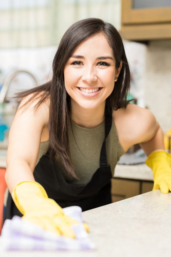 Professional cleaner providing regular home cleaning